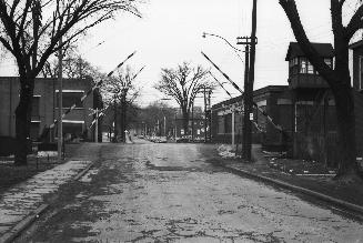 Image shows a street view looking towards the CPR crossing.