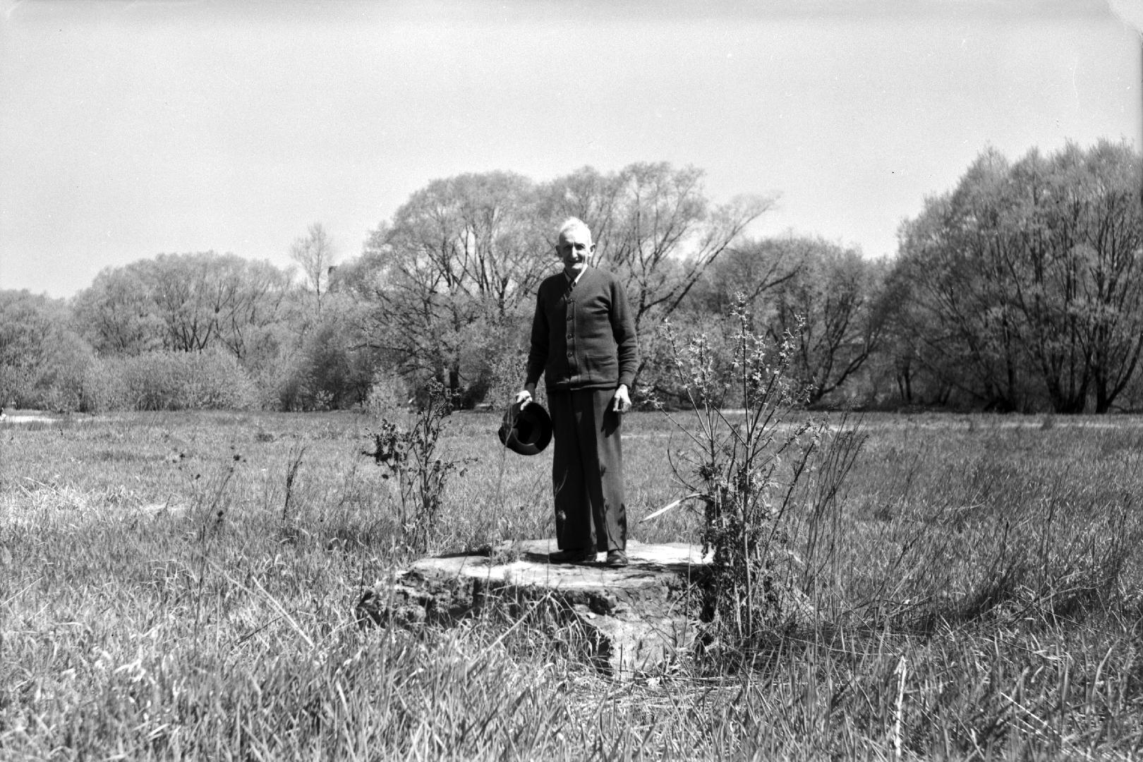 Image shows a gentleman posing for a picture on the lawn.