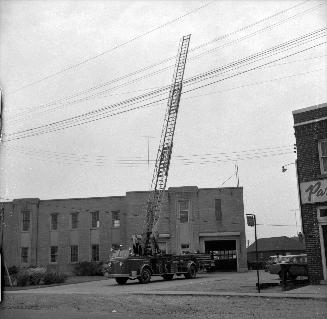 Aerial truck, looking east from Sutherland Drive to Leaside Municipal Building, McRae Drive, southwest corner Randolph Road