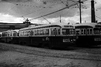 Image shows a few rail cars on the tracks.