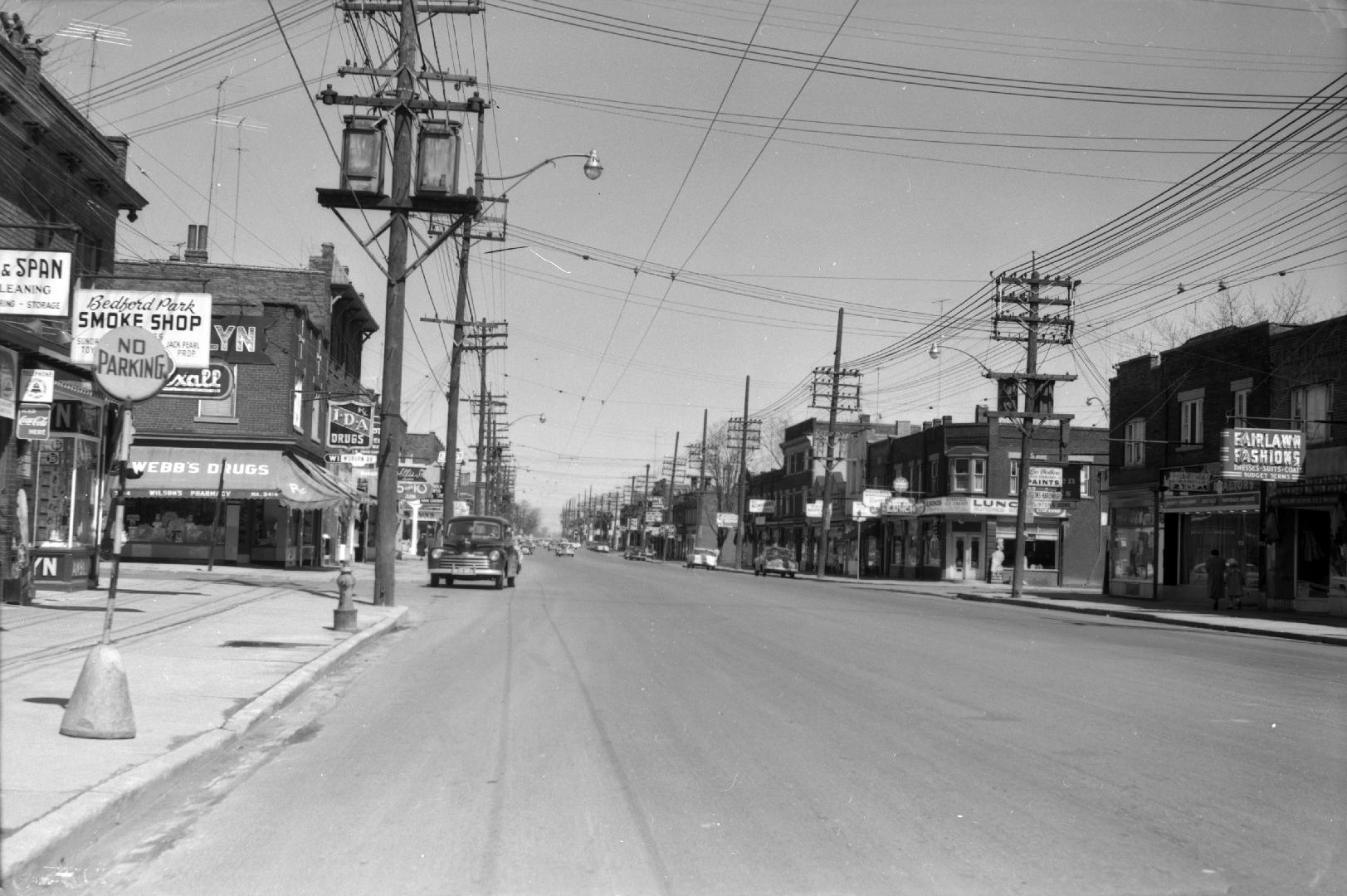 Yonge St., looking north from south of Woburn Ave. Image shows Yonge street with houses along b…