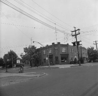 Image shows a street view and a few low rise buildings.