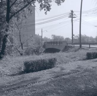 Eglinton Avenue W., bridge over G.T.R. Belt Line, between Spadina Road & Chaplin Crescent, looking southeast. Toronto, Ontario