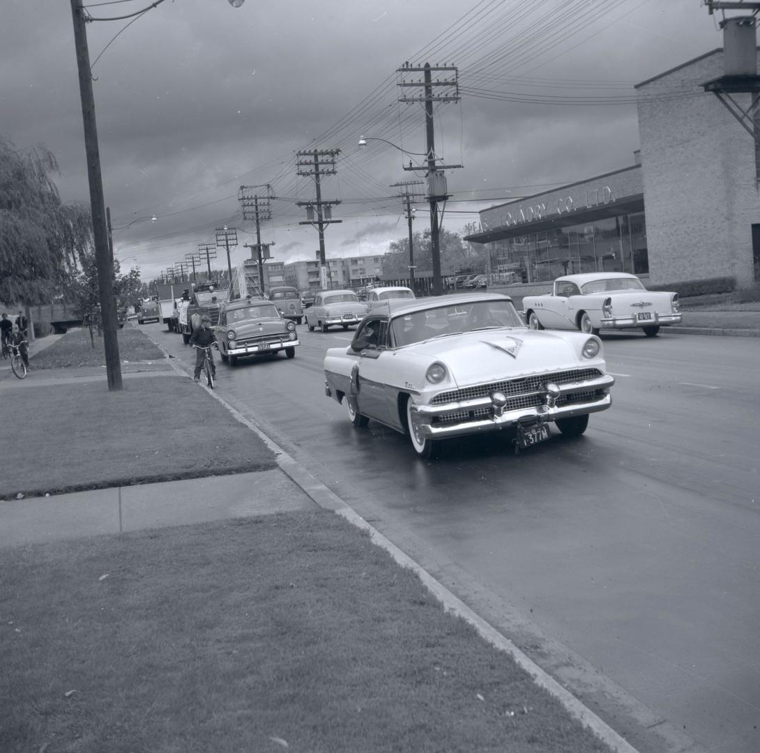 Image shows vehicles participating in the parade. 