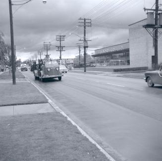 Image shows a parade vehicle on the street.