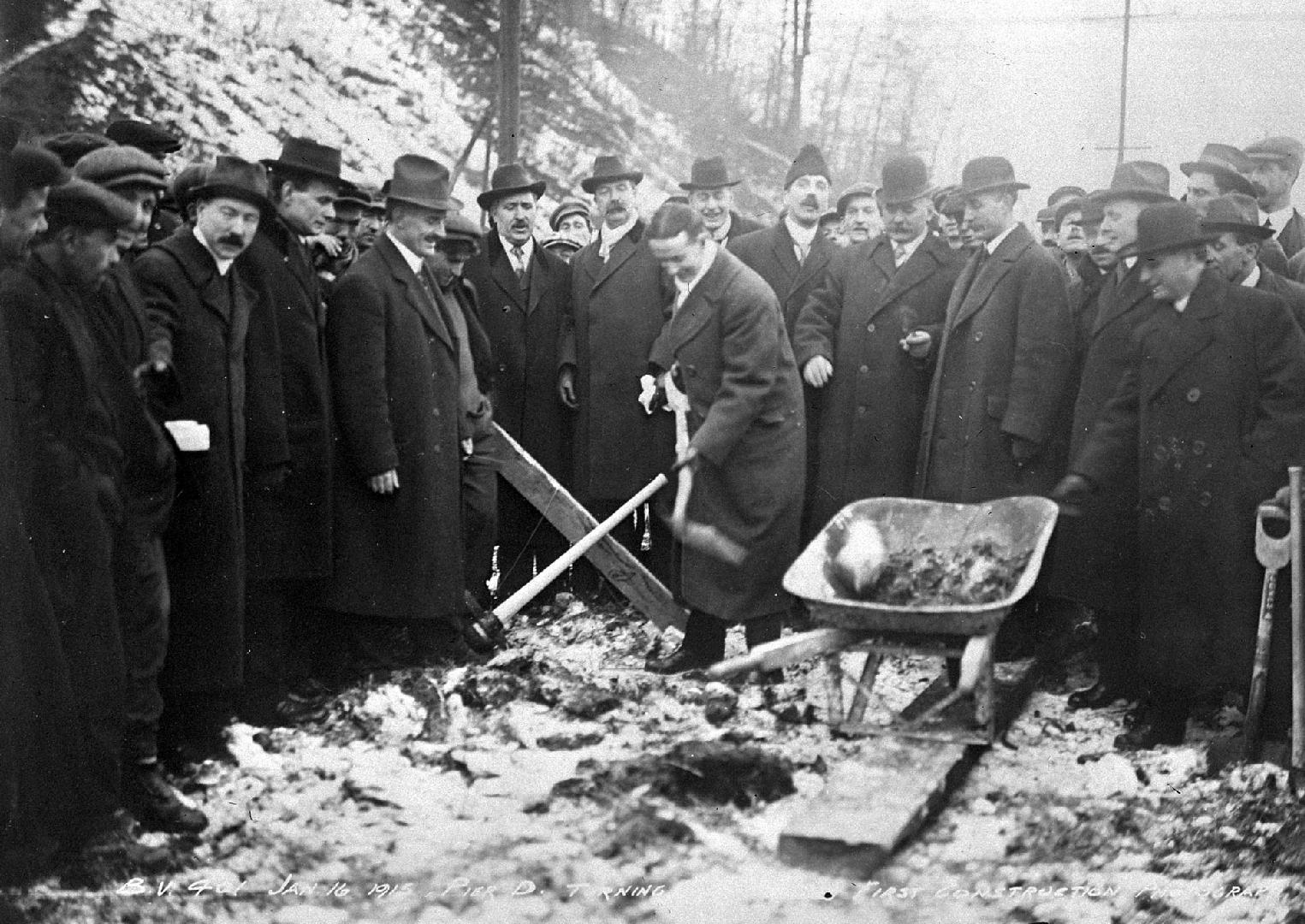 Image shows a group or people gathered for the ceremony. 