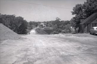 Jane St., looking north from north of Lambton Avenue, during construction. Toronto, Ontario