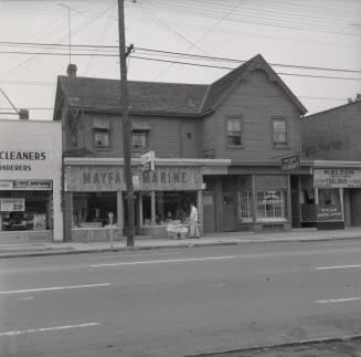 Bedford Park Hotel, Yonge St., west side, south of Fairlawn Avenue. Image shows a two storey ho…