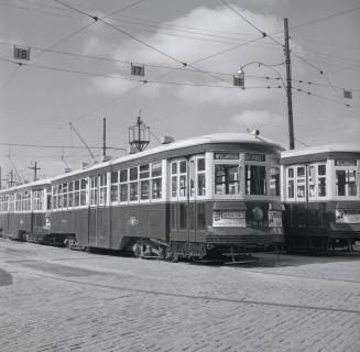 Image shows a few rail cars on the tracks. 