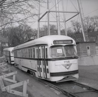 Image shows a few rail cars on the tracks.