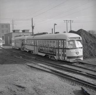 Image shows a few rail cars on tracks.