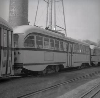 Image shows a few rail cars on tracks.