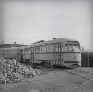 Image shows a few rail cars on tracks.