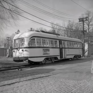 Image shows a TTC rail car on tracks.