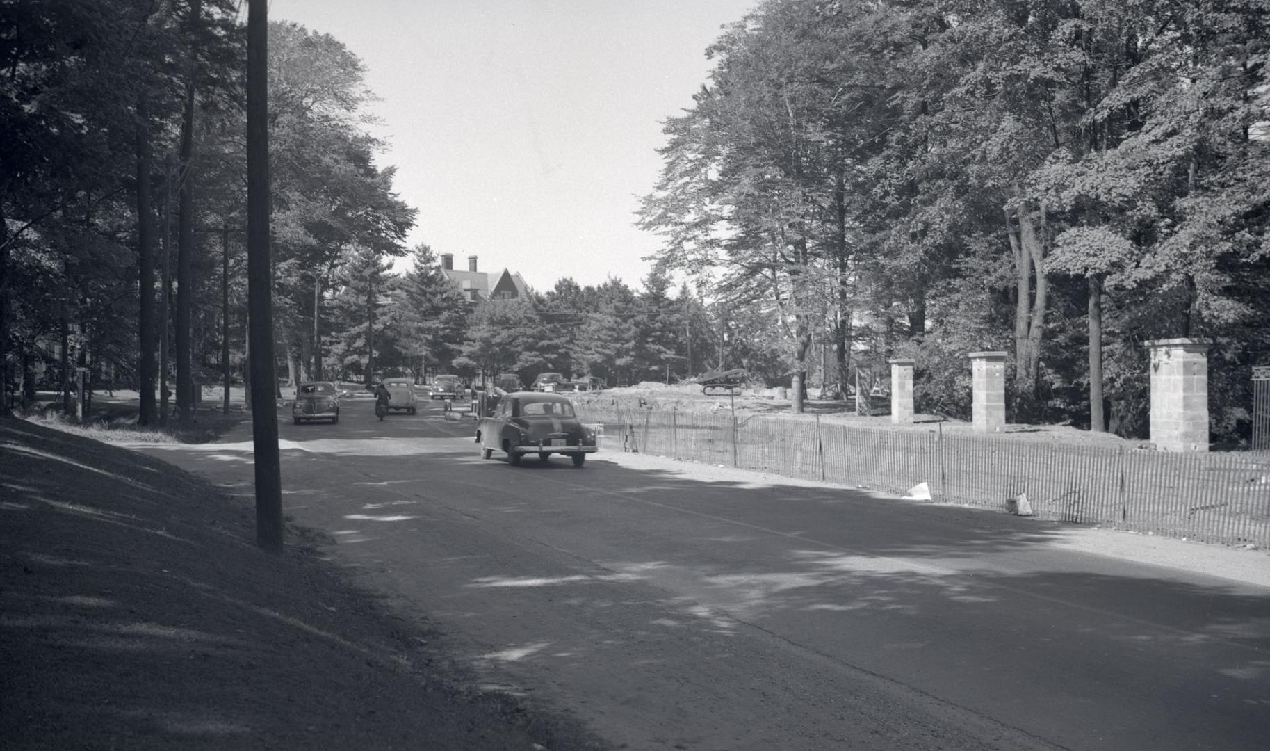 Image shows a street view with a car on it.