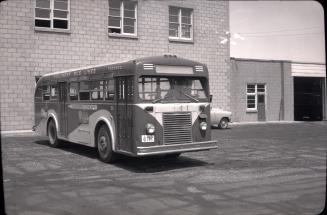 Hollinger Bus Lines, bus #66, at garage, Woodbine Avenue, southeast corner O'Connor Drive, looking east