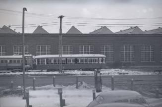 Image shows a few rail cars on the tracks. 