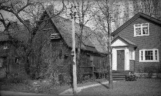 Image shows a few two storey residential houses.