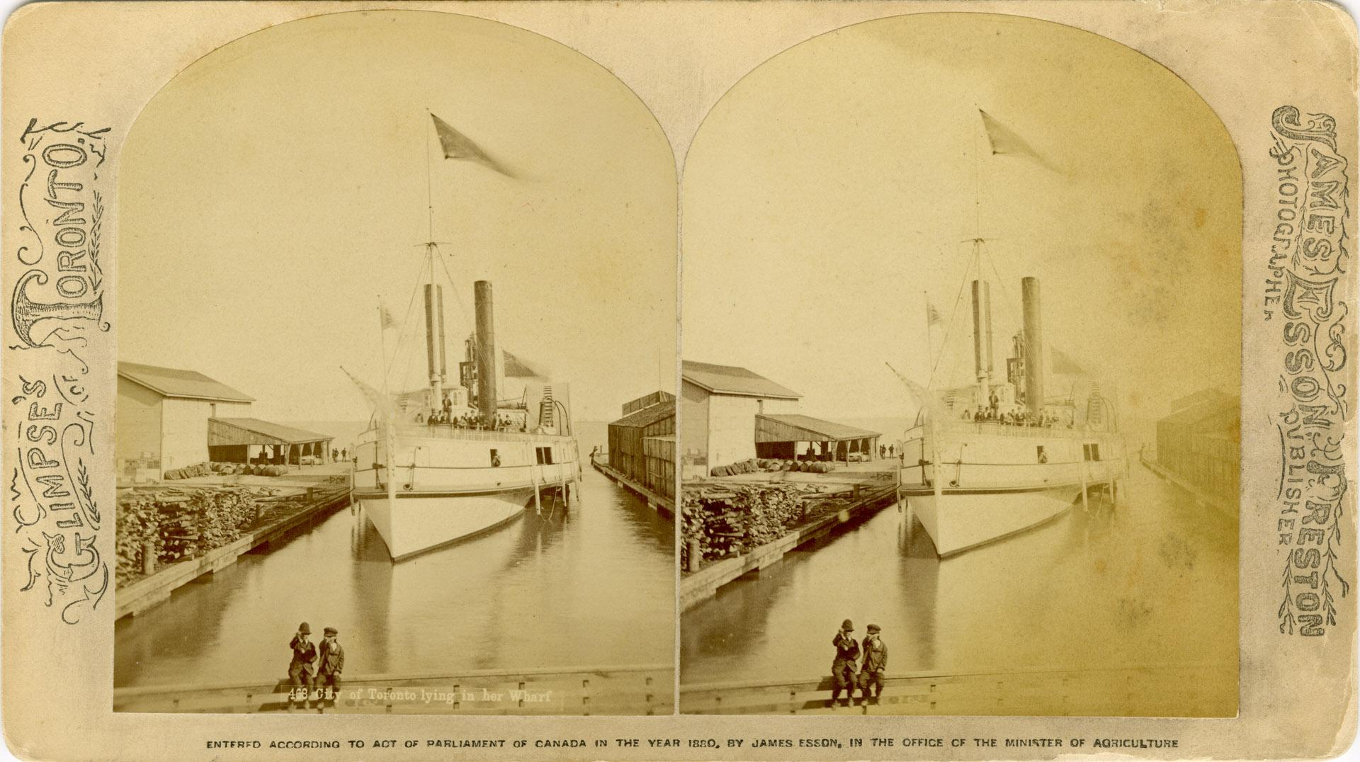 Image shows a ship on the lake by the wharf.