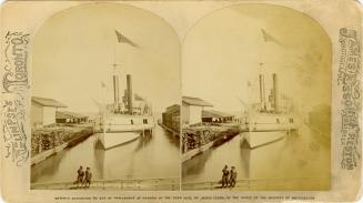 Image shows a ship on the lake by the wharf.