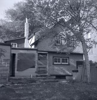 Image shows a two storey house.