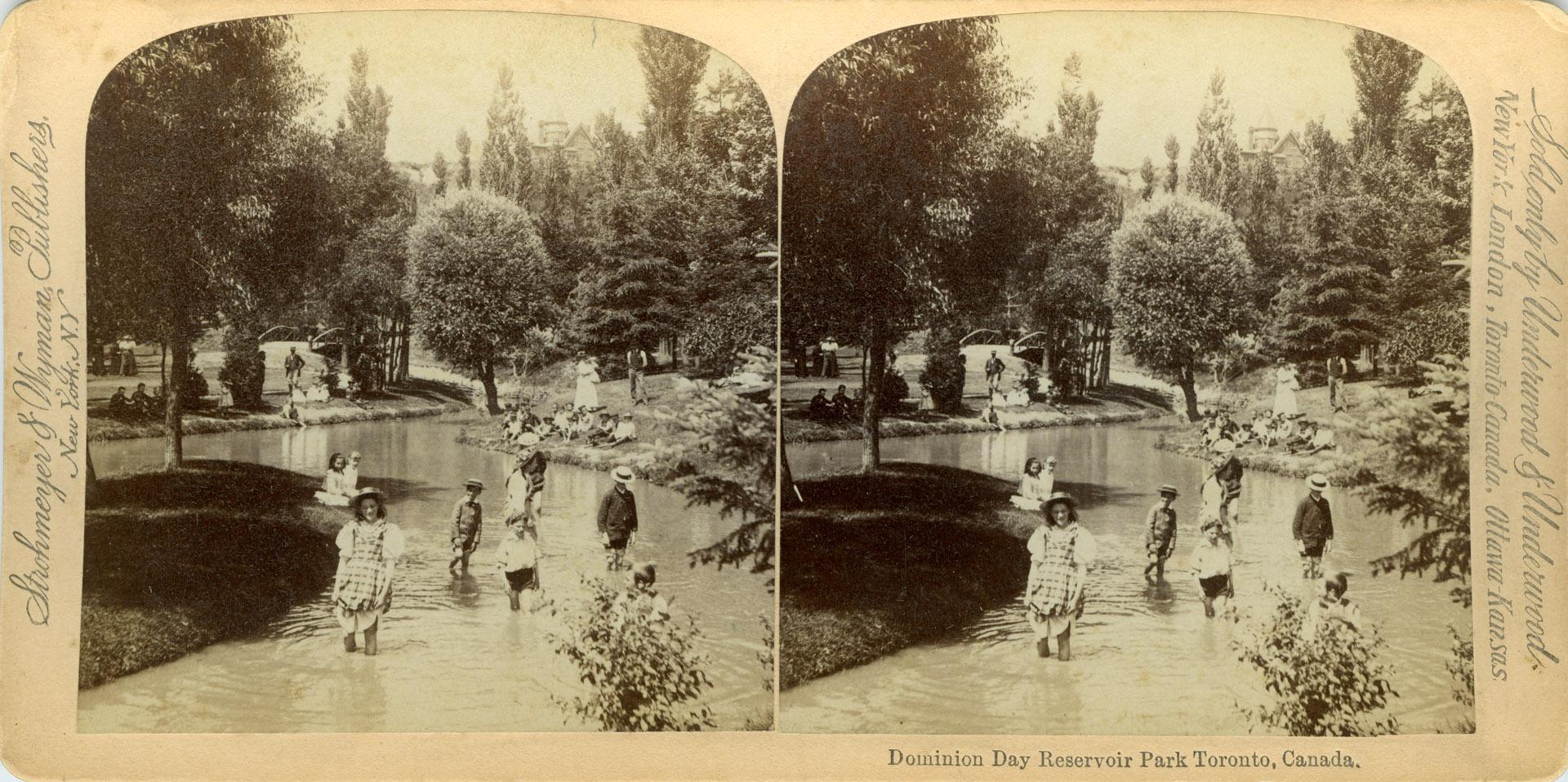 Image shows some people walking along the water reservoir.