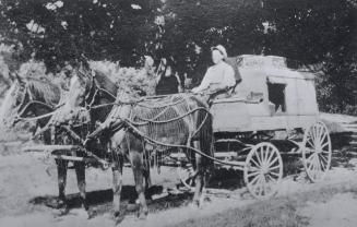 Cart, (delivery wagon), North Toronto, Ontario. Image shows a person sitting on the delivery ca…