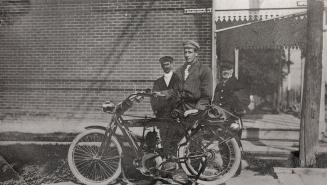 Imperial Street, northwest corner Yonge Street, Toronto, Ontario. Image shows a three men stand…