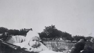 Manor Road East, Toronto, Ontario. Image shows a baby in a stroller with the street view in the…