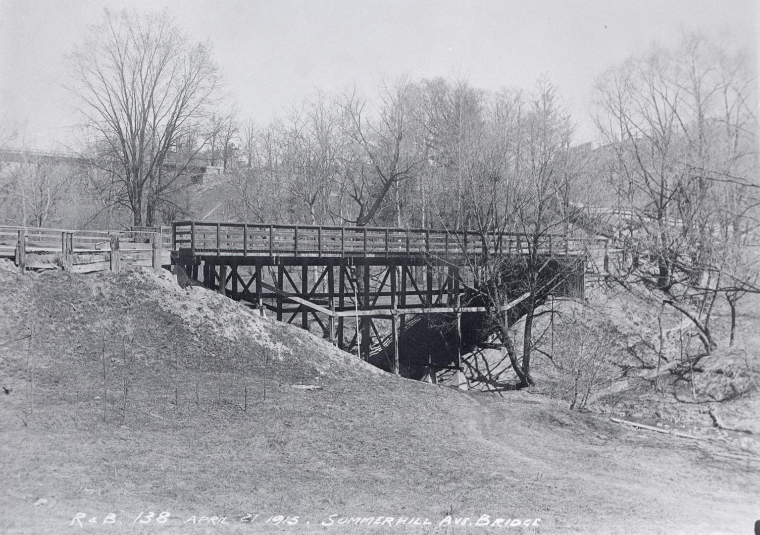 Image shows a bridge over a stream.