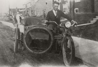 Snowdon Avenue, between Mount Pleasant Road and Ronan Avenue. Image shows a gentleman sitting o…