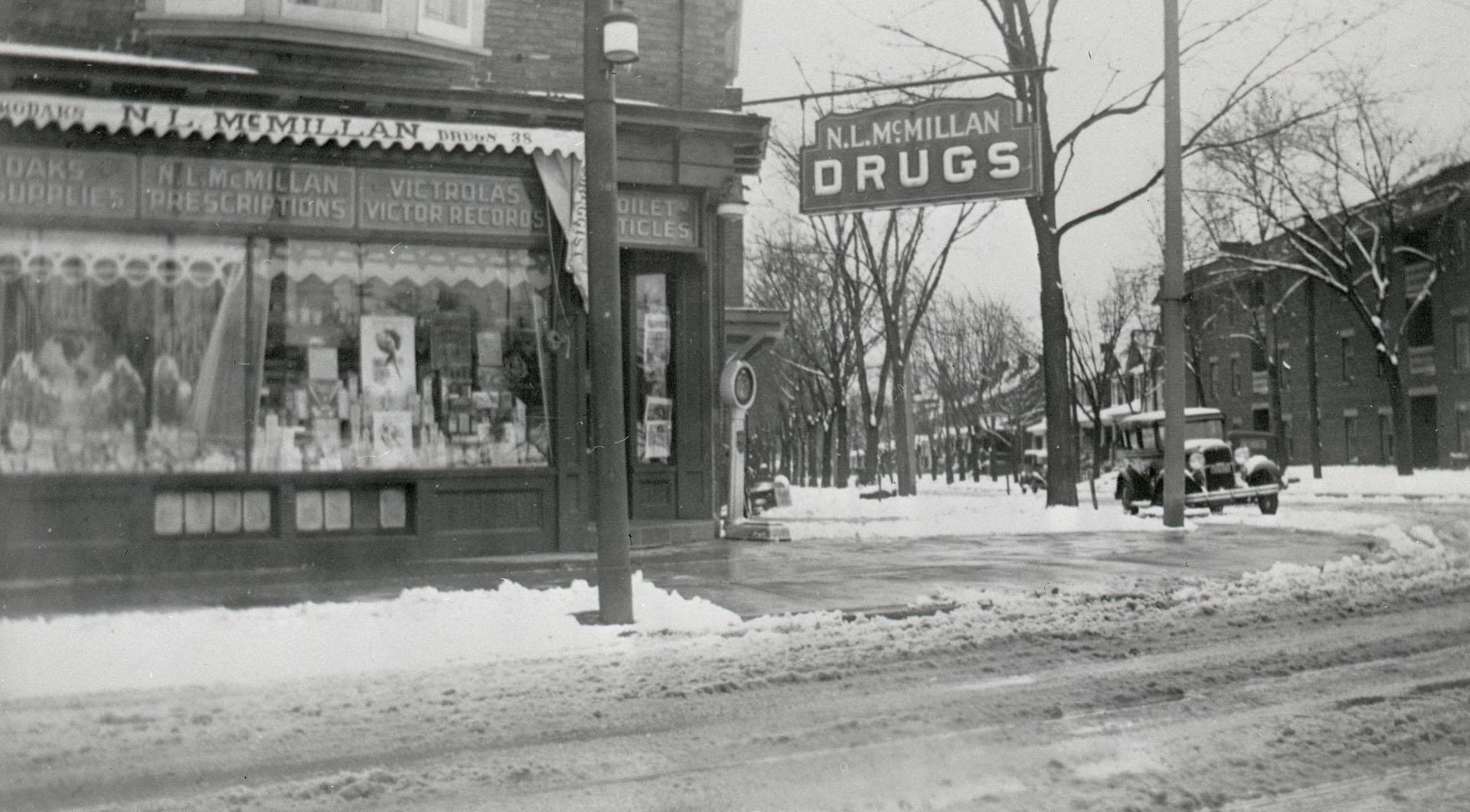  Image shows the front windows of the drug store that is located on the ground floor of a two s…