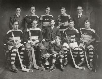 North Toronto Hockey Club. Image shows ten men and one child in two rows posing for a photo ind…