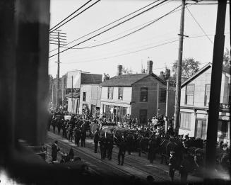 Salvation Army, funeral procession of victims of Empress of Ireland sinking, on Yonge Street, looking northeast to Baxter St. at right of centre