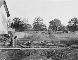 Image shows a road view with a building on the left.