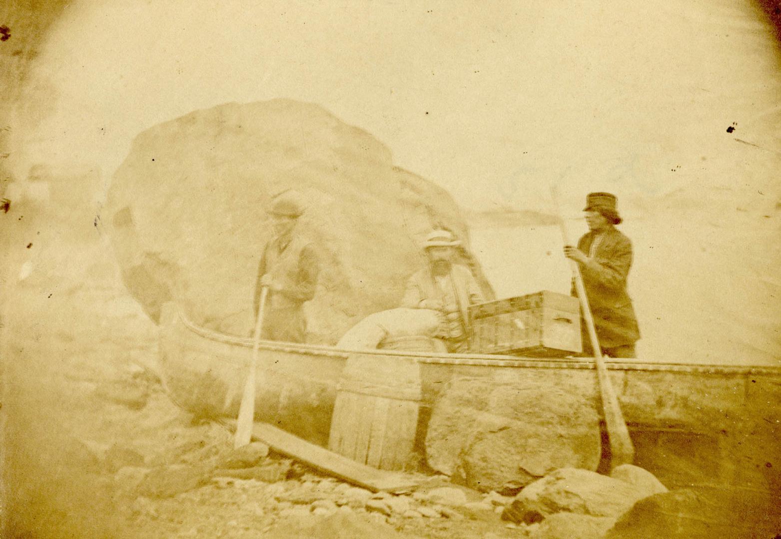 Robert Cunningham, reporter for Toronto Daily Telegraph, and Indians, beside canoe