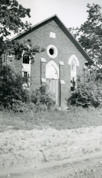 Image shows the front partial view of the Claremont Wesleyan Methodist Church, 1869 (beside Eme…