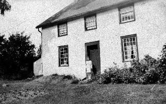 Image shows a two storey log house built by John Bales in 1823 (later York Downs Golf Club), To…