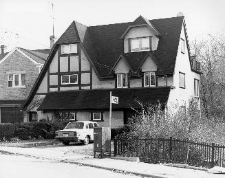 House, Lytton Boulevard, southeast corner of Begg Parkette, Toronto, Ontario. Image shows a thr…