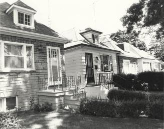 Houses, Bedford Park Avenue, north side, west of Greer Road, Toronto, Ontario. Image shows a ro…