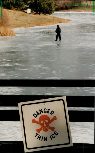 Jonathan Foti, 15, walks on lake Aquitaine in Mississauga, Despite warnings