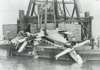 Three died yesterday when this eight-passenger Cessna 401 crashed into Lake Ontario while turning for landing at Toronto Island Airport. 