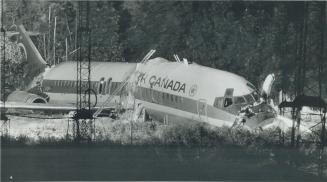 Two people died and 105 were injured when Air Canada DC-9 skidded into ravine and broke up at Toronto International Airport