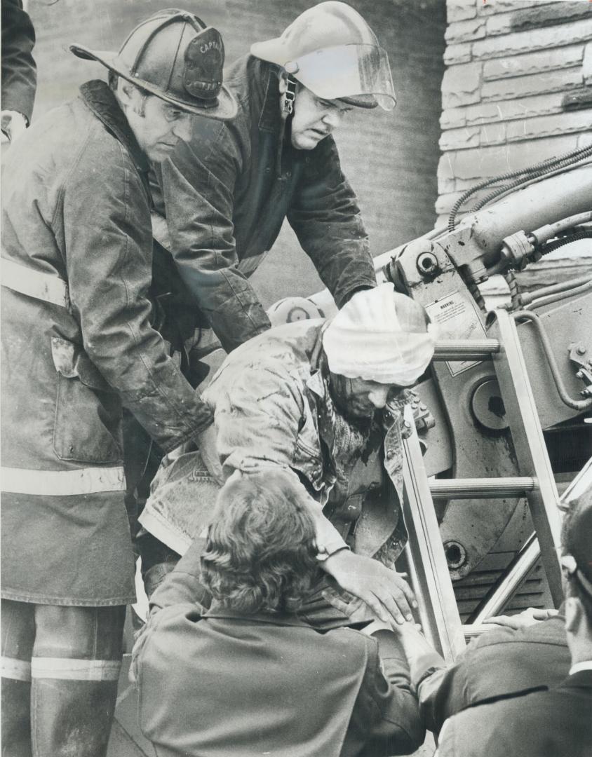 Firemen give Bill Walters first aid