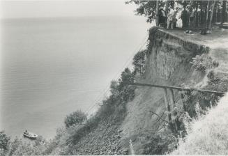 Cliffside Drama: June Wade was weeding her garden when she lost her balance and fell down this cliff behind her Guildwood Parkway home