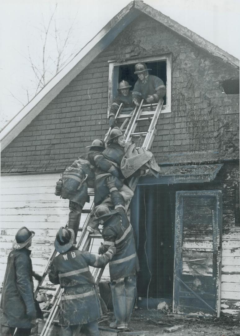 Caught in the holocaust which engulfed the Downsview home of David Lumsden early today, the blanket-wrapped body of one of his six dead children is br(...)