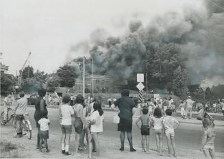 Smoke billows into the sky above Roseland Public School in the borough of York today as fire gutted the 50-year-old building, displacing more than 600(...)