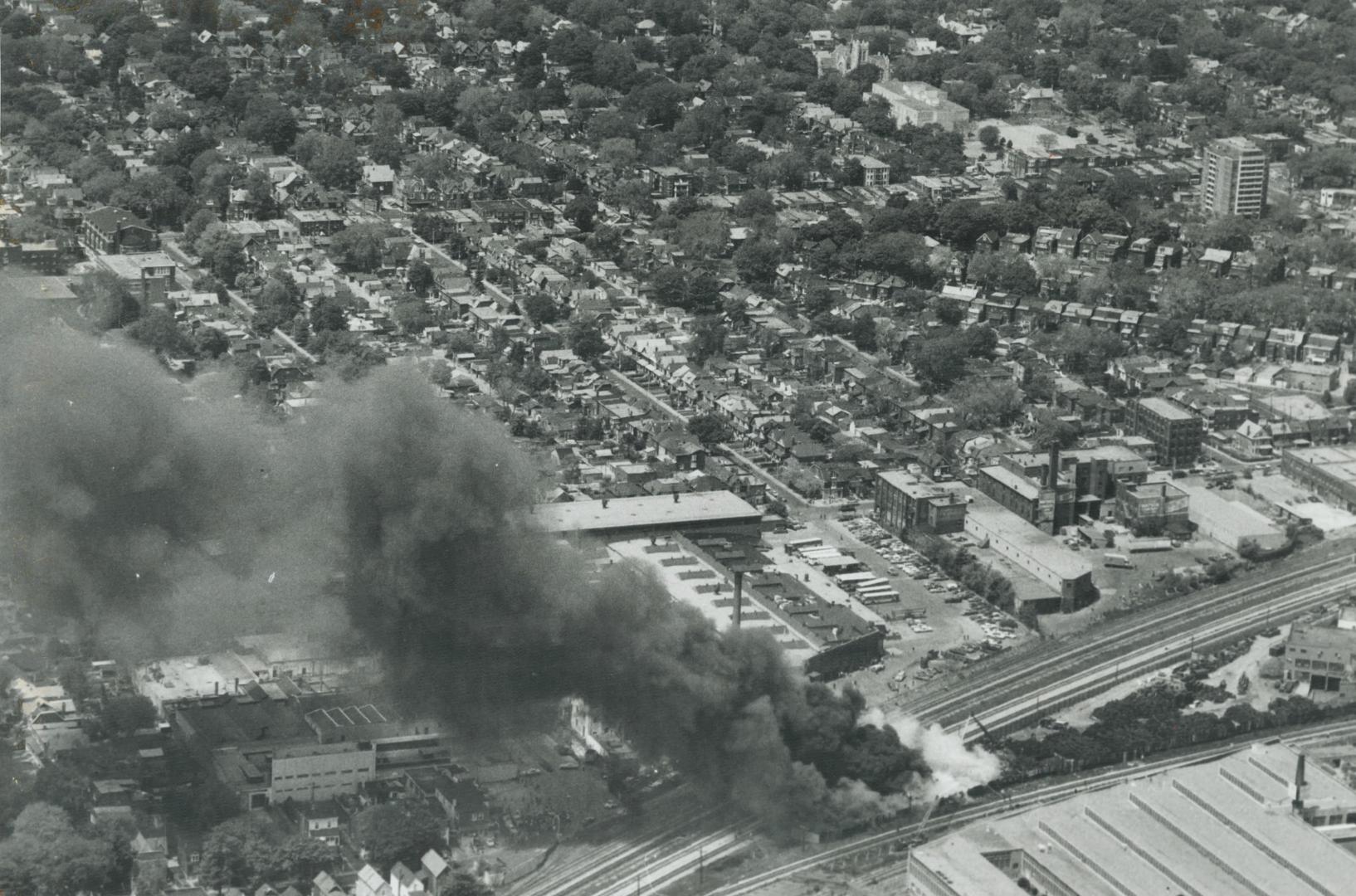 Pillar of smoke. Smoke could be seen for up to five miles today from a fire in a westend Toronto tire scrapyard. Lack of water pressure hampered firem(...)