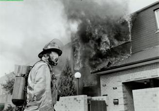 Distraught: Josephine Rybicki is in anguish as her townhouse burns