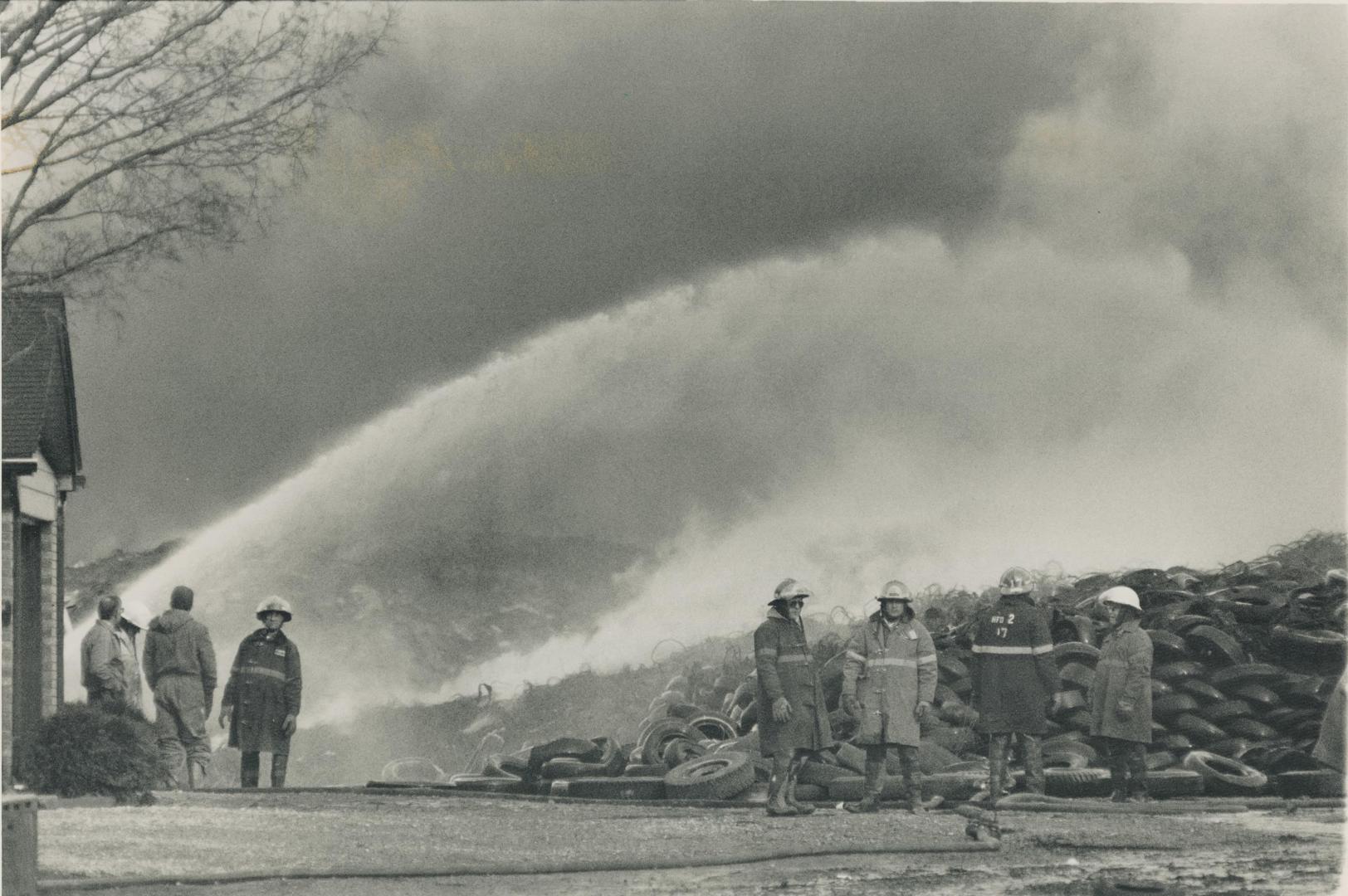 Firefighters try in vain yesterday to quench the blaze that s been burning out of control near Hagersville since Monday